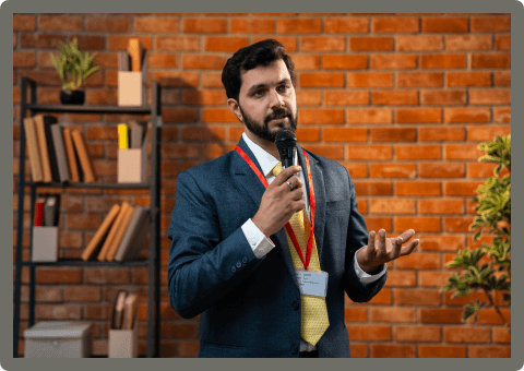 bearded-indian-ceo-giving-formal-speech-using-mic-7ZAKW8Q.png