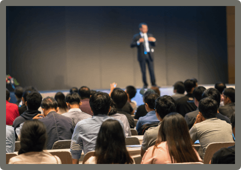 rear-side-of-audiences-sitting-and-listening-the-s-7RKKEH2.png